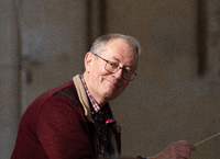 Mar 2022, George glances to soprano soloist Anita Watson during rehearsal